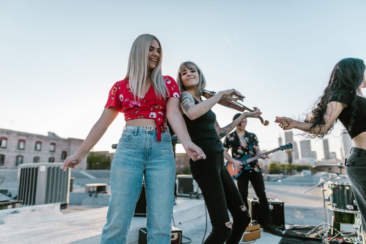 Musicians playing together on a rooftop